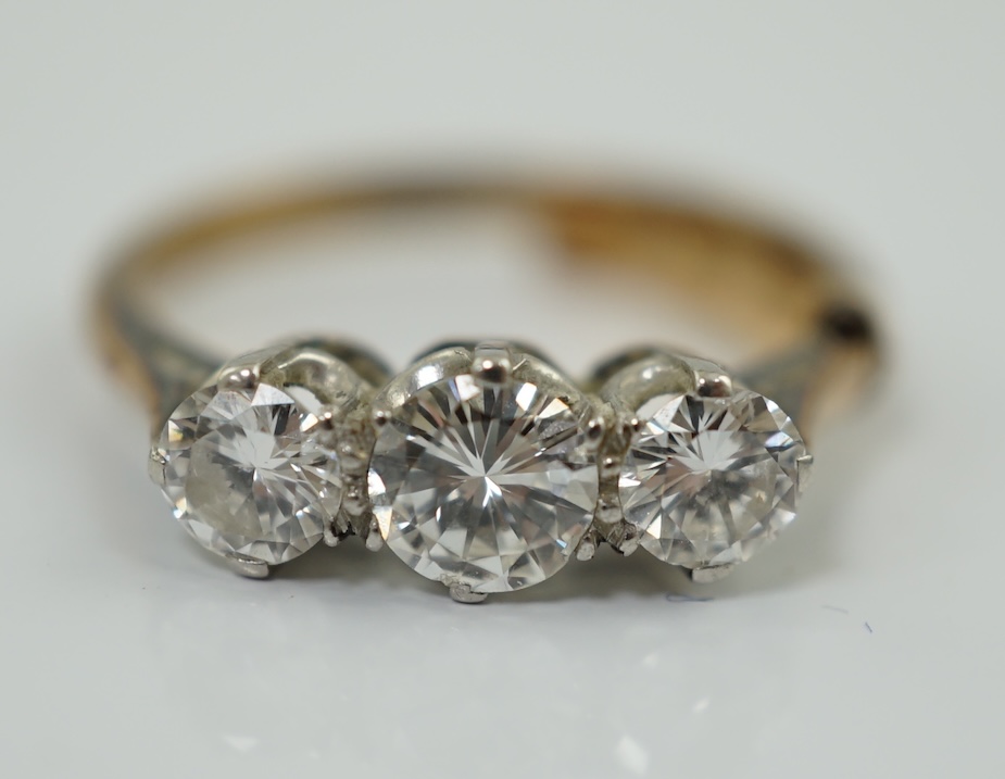 An 18ct gold, platinum and three stone diamond set ring